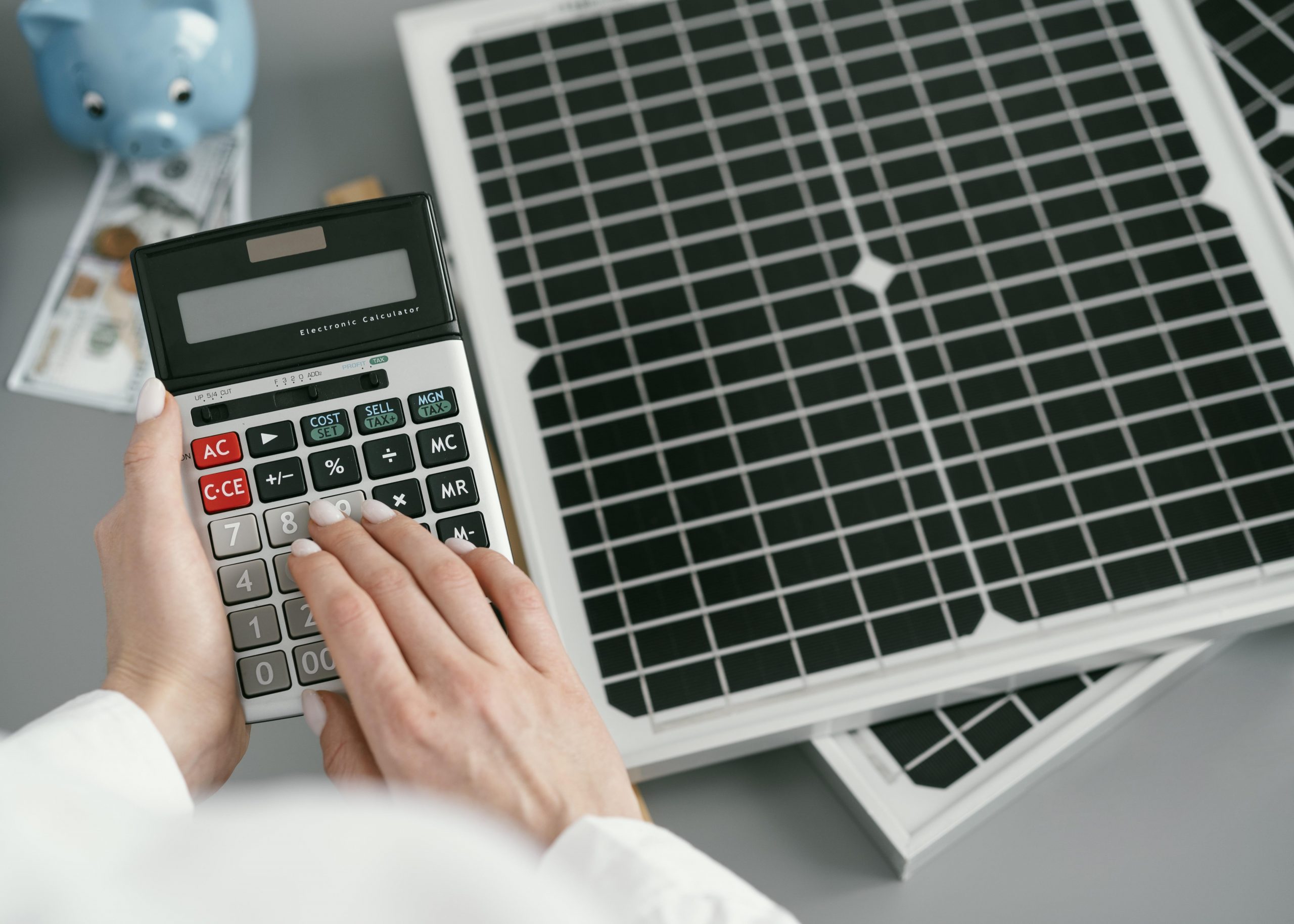 close up hand typing calculator scaled